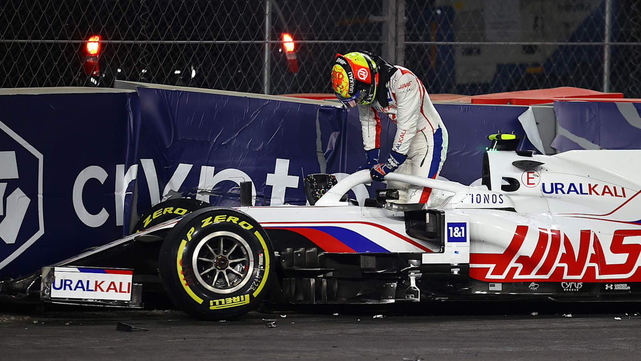 JEDDAH, SAUDI ARABIA - DECEMBER 05: Mick Schumacher of Germany driving the (47) Haas F1 Team VF-21 Ferrari climbs from his car after crashing during the F1 Grand Prix of Saudi Arabia at Jeddah Corniche Circuit on December 05, 2021 in Jeddah, Saudi Arabia. (Photo by Bryn Lennon - Formula 1/Formula 1 via Getty Images)