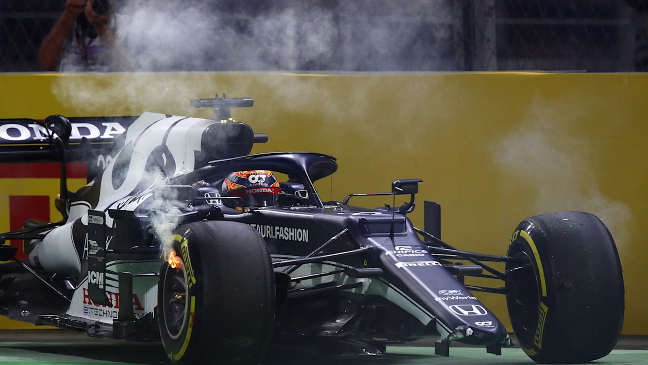 JEDDAH, SAUDI ARABIA - DECEMBER 05: Yuki Tsunoda of Japan driving the (22) Scuderia AlphaTauri AT02 Honda with a broken front wing and flaming brakes after a crash  during the F1 Grand Prix of Saudi Arabia at Jeddah Corniche Circuit on December 05, 2021 in Jeddah, Saudi Arabia. (Photo by Joe Portlock - Formula 1/Formula 1 via Getty Images)