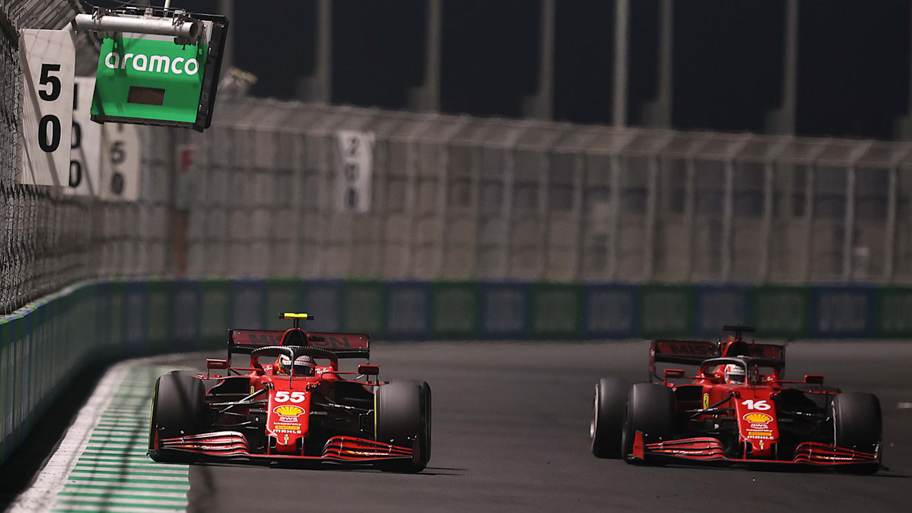 JEDDAH, SAUDI ARABIA - DECEMBER 05: Charles Leclerc of Monaco driving the (16) Scuderia Ferrari SF21 and Carlos Sainz of Spain driving the (55) Scuderia Ferrari SF21 during the F1 Grand Prix of Saudi Arabia at Jeddah Corniche Circuit on December 05, 2021 in Jeddah, Saudi Arabia. (Photo by Lars Baron/Getty Images)