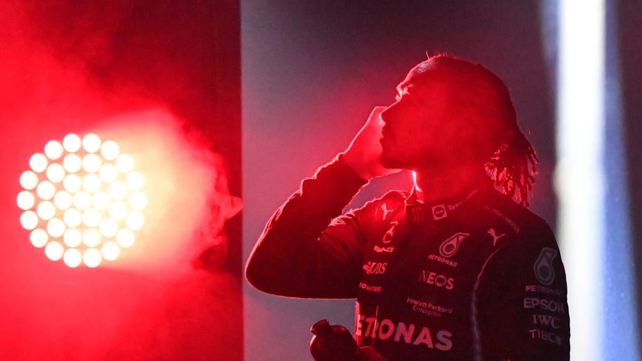JEDDAH, SAUDI ARABIA - DECEMBER 05: Race winner Lewis Hamilton of Great Britain and Mercedes GP looks on in parc ferme during the F1 Grand Prix of Saudi Arabia at Jeddah Corniche Circuit on December 05, 2021 in Jeddah, Saudi Arabia. (Photo by Andrej Isakovic - Pool/Getty Images)