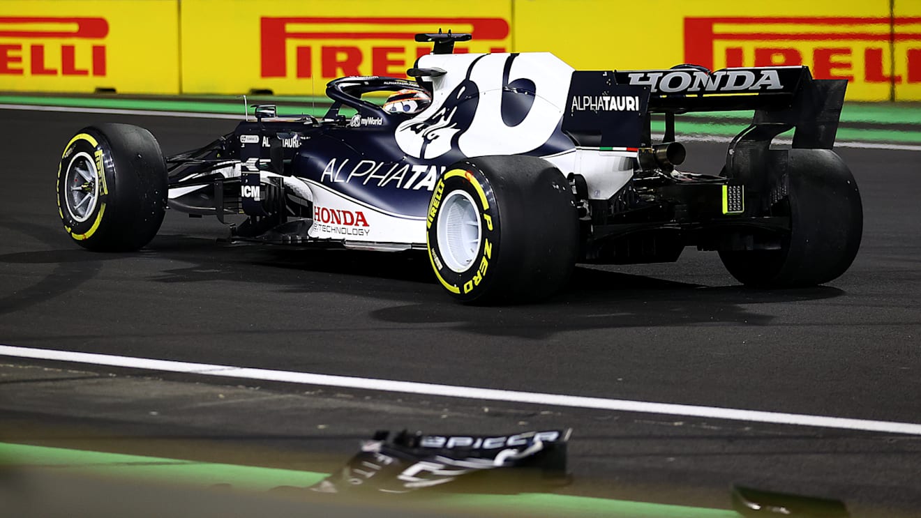 JEDDAH, SAUDI ARABIA - DECEMBER 05: Yuki Tsunoda of Japan driving the (22) Scuderia AlphaTauri AT02 Honda with a broken front wing after a crash  during the F1 Grand Prix of Saudi Arabia at Jeddah Corniche Circuit on December 05, 2021 in Jeddah, Saudi Arabia. (Photo by Bryn Lennon - Formula 1/Formula 1 via Getty Images)