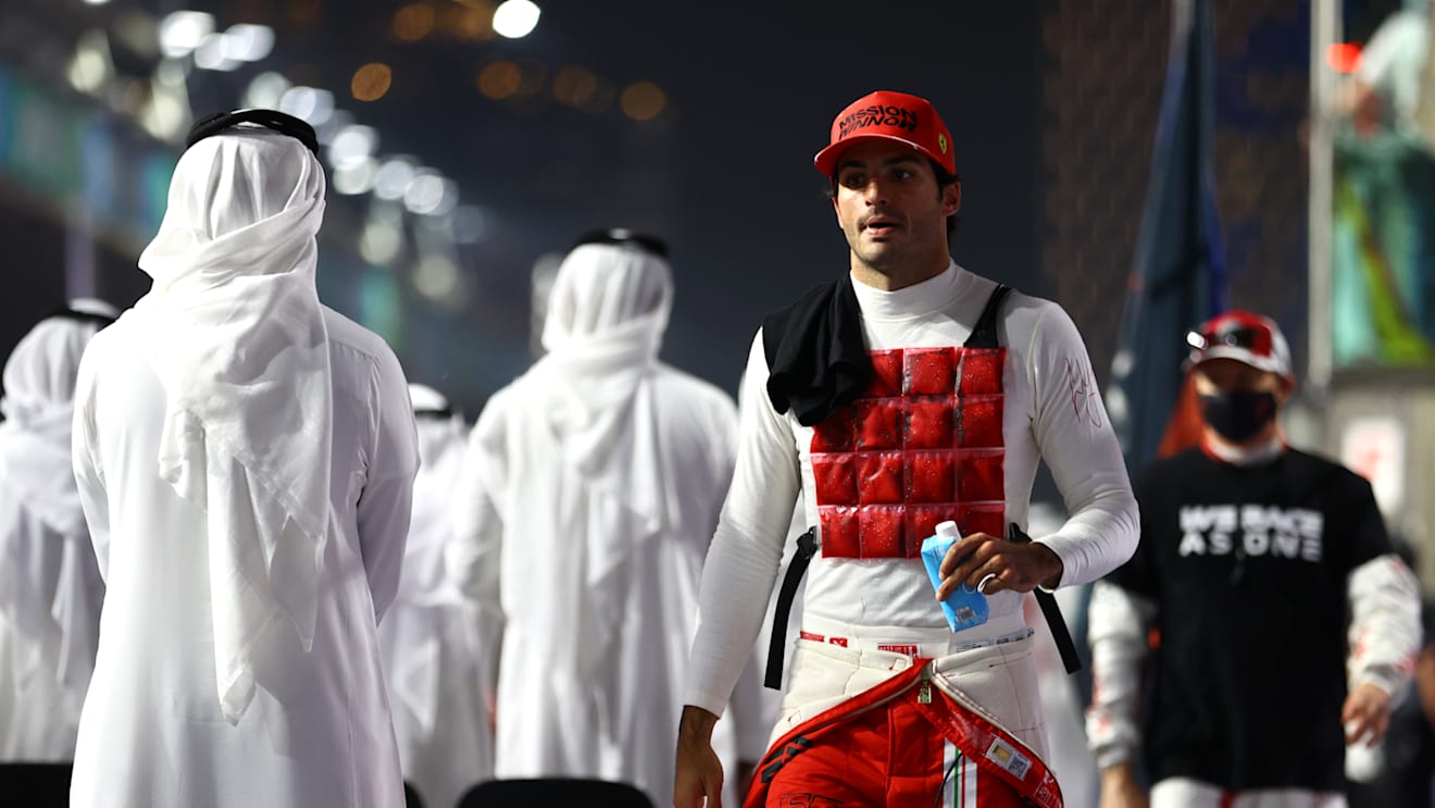 JEDDAH, SAUDI ARABIA - DECEMBER 05: Carlos Sainz of Spain and Ferrari prepares to drive on the grid during the F1 Grand Prix of Saudi Arabia at Jeddah Corniche Circuit on December 05, 2021 in Jeddah, Saudi Arabia. (Photo by Bryn Lennon - Formula 1/Formula 1 via Getty Images)
