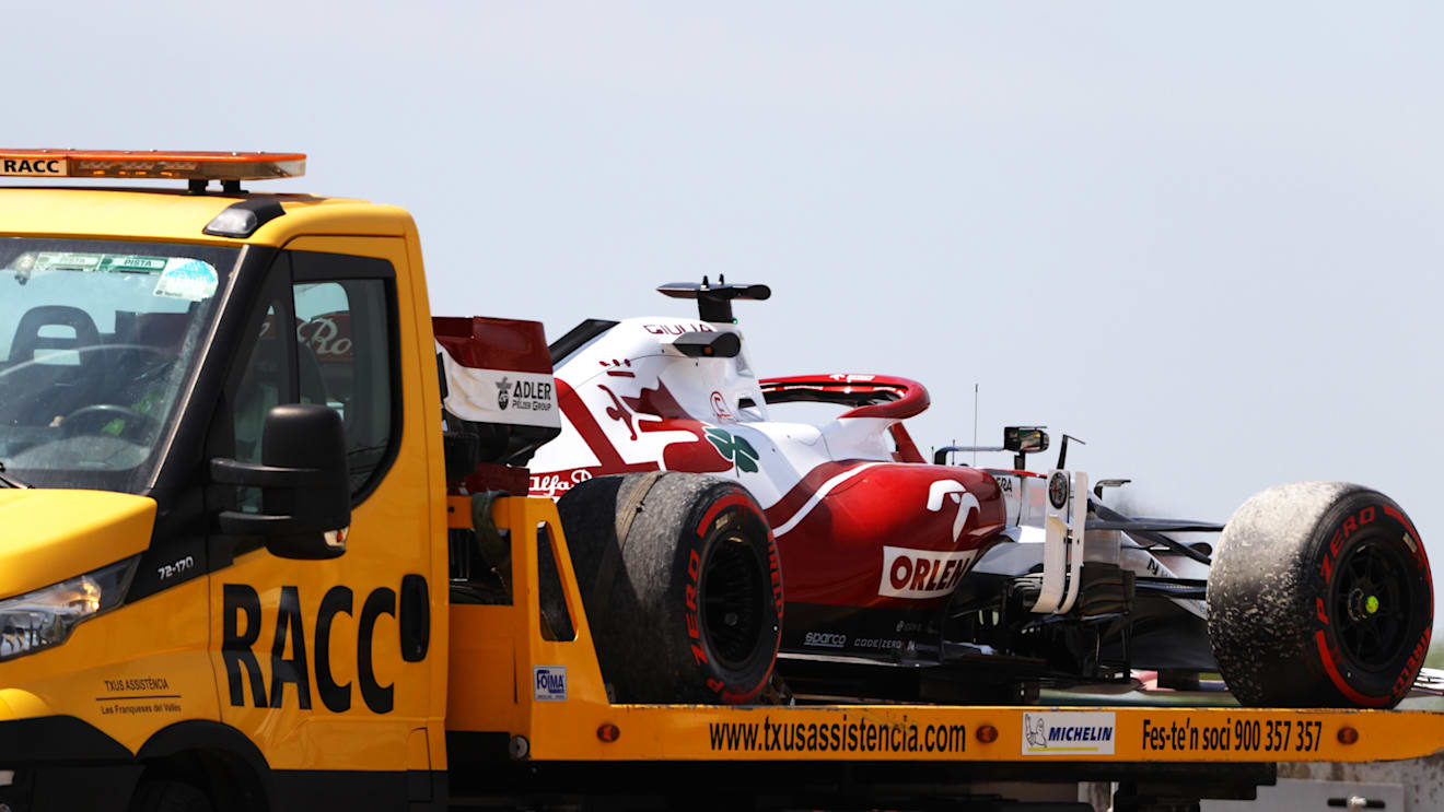 BARCELONA, SPAIN - MAY 07: The car of Robert Kubica of Poland and Alfa Romeo Racing is seen on a tow truck after stopping on track during practice for the F1 Grand Prix of Spain at Circuit de Barcelona-Catalunya on May 07, 2021 in Barcelona, Spain. (Photo by Bryn Lennon/Getty Images)