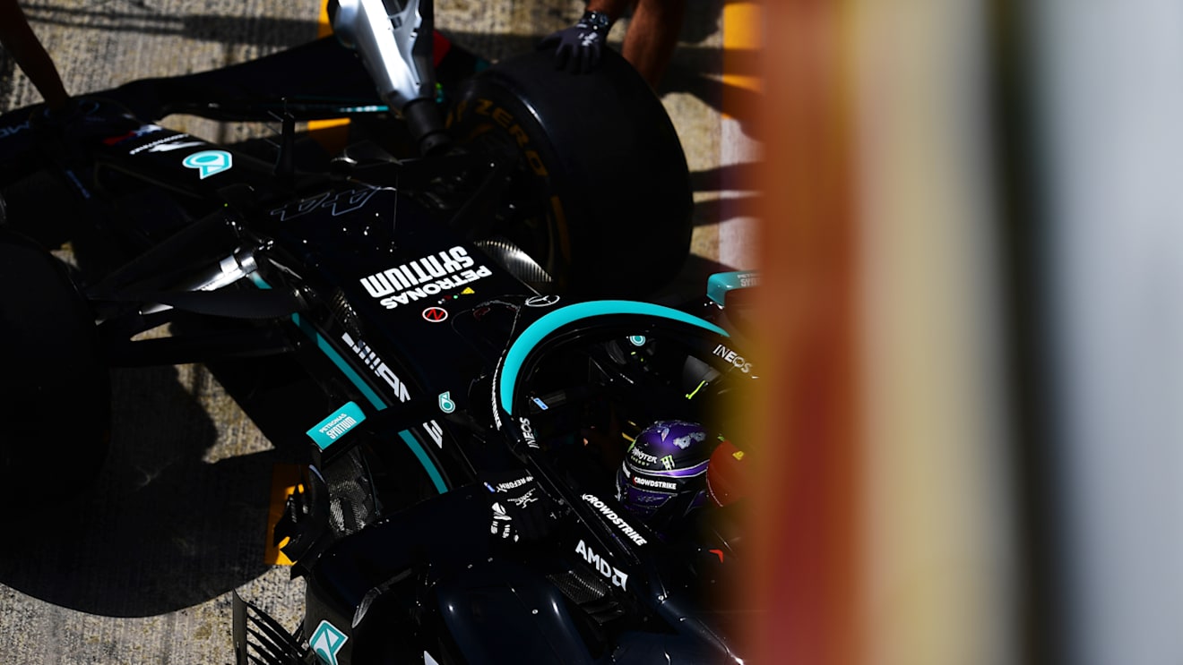 BARCELONA, SPAIN - MAY 07: Lewis Hamilton of Great Britain driving the (44) Mercedes AMG Petronas F1 Team Mercedes W12 is pushed into the garage during practice for the F1 Grand Prix of Spain at Circuit de Barcelona-Catalunya on May 07, 2021 in Barcelona, Spain. (Photo by Mario Renzi - Formula 1/Formula 1 via Getty Images)
