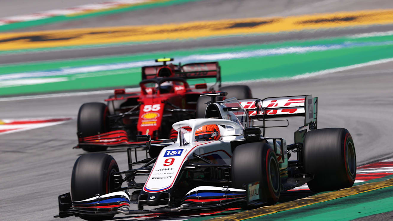 BARCELONA, SPAIN - MAY 08: Nikita Mazepin of Russia driving the (9) Haas F1 Team VF-21 Ferrari leads Carlos Sainz of Spain driving the (55) Scuderia Ferrari SF21 during final practice for the F1 Grand Prix of Spain at Circuit de Barcelona-Catalunya on May 08, 2021 in Barcelona, Spain. (Photo by Lars Baron/Getty Images)