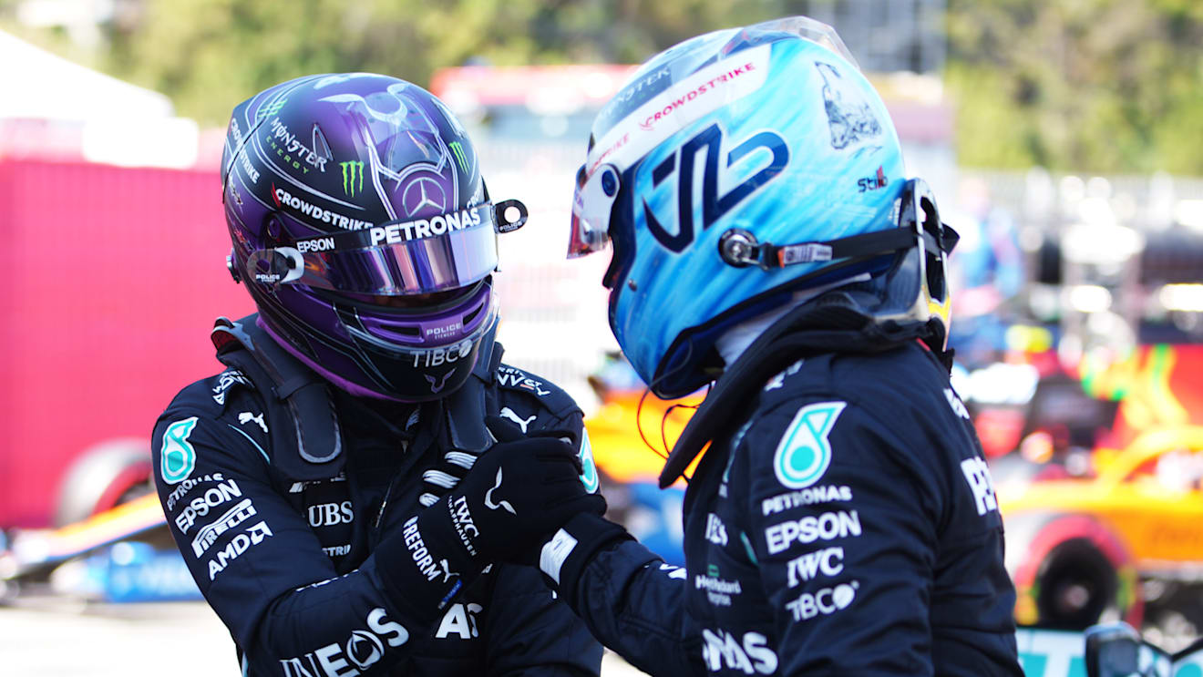 BARCELONA, SPAIN - MAY 08: Pole position qualifier Lewis Hamilton of Great Britain and Mercedes GP interacts with teammate and third placed qualifier Valtteri Bottas of Finland and Mercedes GP in parc ferme during qualifying for the F1 Grand Prix of Spain at Circuit de Barcelona-Catalunya on May 08, 2021 in Barcelona, Spain. (Photo by Emilio Morenatti - Pool/Getty Images)
