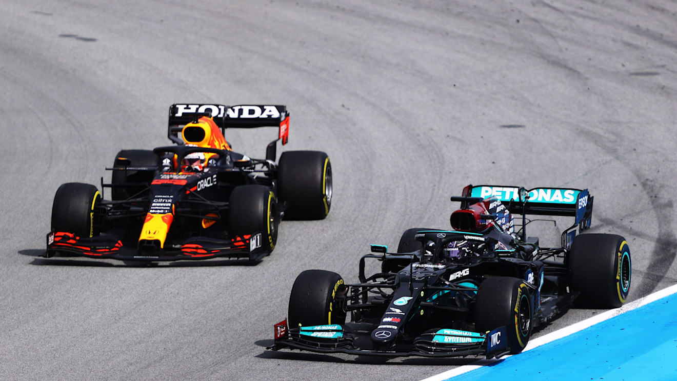 BARCELONA, SPAIN - MAY 09: Lewis Hamilton of Great Britain driving the (44) Mercedes AMG Petronas F1 Team Mercedes W12 leads Max Verstappen of the Netherlands driving the (33) Red Bull Racing RB16B Honda on track during the F1 Grand Prix of Spain at Circuit de Barcelona-Catalunya on May 09, 2021 in Barcelona, Spain. (Photo by Bryn Lennon/Getty Images)