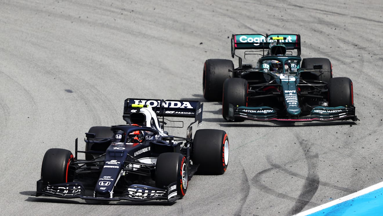 BARCELONA, SPAIN - MAY 09: Pierre Gasly of France driving the (10) Scuderia AlphaTauri AT02 Honda leads Sebastian Vettel of Germany driving the (5) Aston Martin AMR21 Mercedes on track during the F1 Grand Prix of Spain at Circuit de Barcelona-Catalunya on May 09, 2021 in Barcelona, Spain. (Photo by Bryn Lennon/Getty Images)