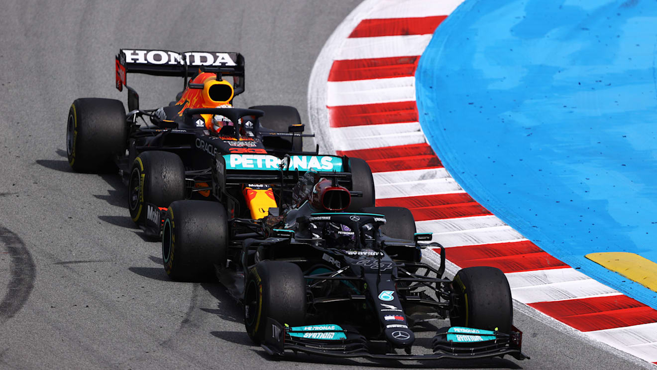 BARCELONA, SPAIN - MAY 09: Lewis Hamilton of Great Britain driving the (44) Mercedes AMG Petronas F1 Team Mercedes W12 leads Max Verstappen of the Netherlands driving the (33) Red Bull Racing RB16B Honda on track during the F1 Grand Prix of Spain at Circuit de Barcelona-Catalunya on May 09, 2021 in Barcelona, Spain. (Photo by Bryn Lennon/Getty Images)