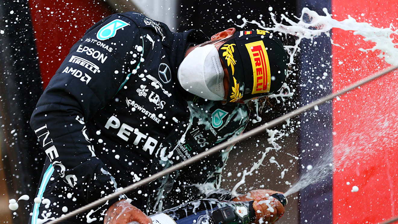 BARCELONA, SPAIN - MAY 09:  Lewis Hamilton of Great Britain  Mercedes AMG Petronas celebrates on the podium after winning the F1 Grand Prix of Spain at Circuit de Barcelona-Catalunya on May 09, 2021 in Barcelona, Spain. (Photo by Dan Istitene - Formula 1/Formula 1 via Getty Images)