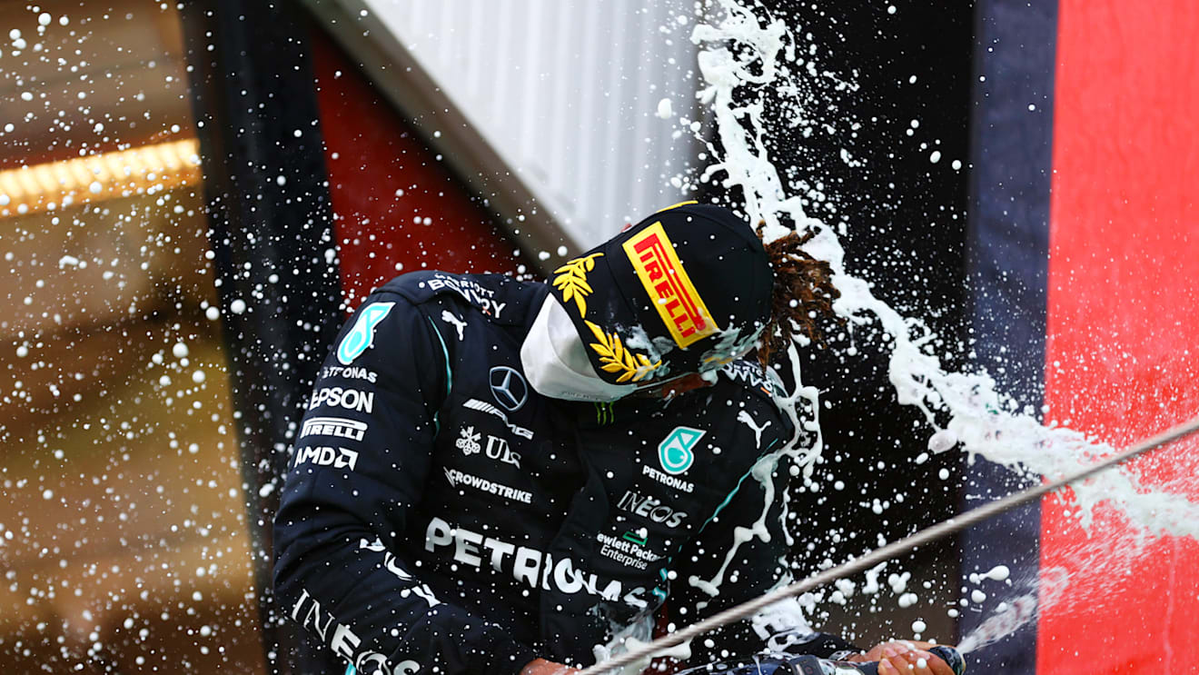BARCELONA, SPAIN - MAY 09:  Lewis Hamilton of Great Britain  Mercedes AMG Petronas celebrates on the podium after winning the F1 Grand Prix of Spain at Circuit de Barcelona-Catalunya on May 09, 2021 in Barcelona, Spain. (Photo by Dan Istitene - Formula 1/Formula 1 via Getty Images)