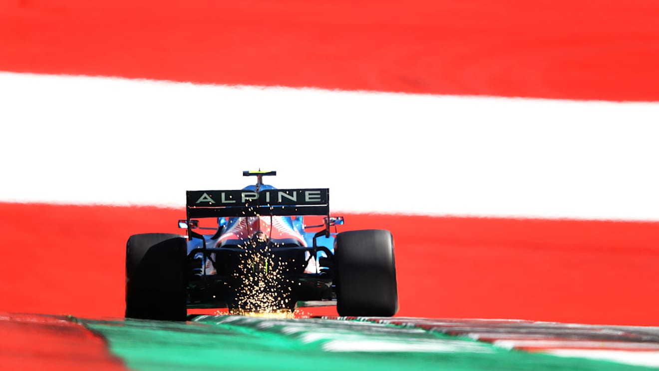 SPIELBERG, AUSTRIA - JUNE 26: Sparks fly behind Esteban Ocon of France driving the (31) Alpine A521 Renault on track during qualifying ahead of the F1 Grand Prix of Styria at Red Bull Ring on June 26, 2021 in Spielberg, Austria. (Photo by Bryn Lennon/Getty Images)