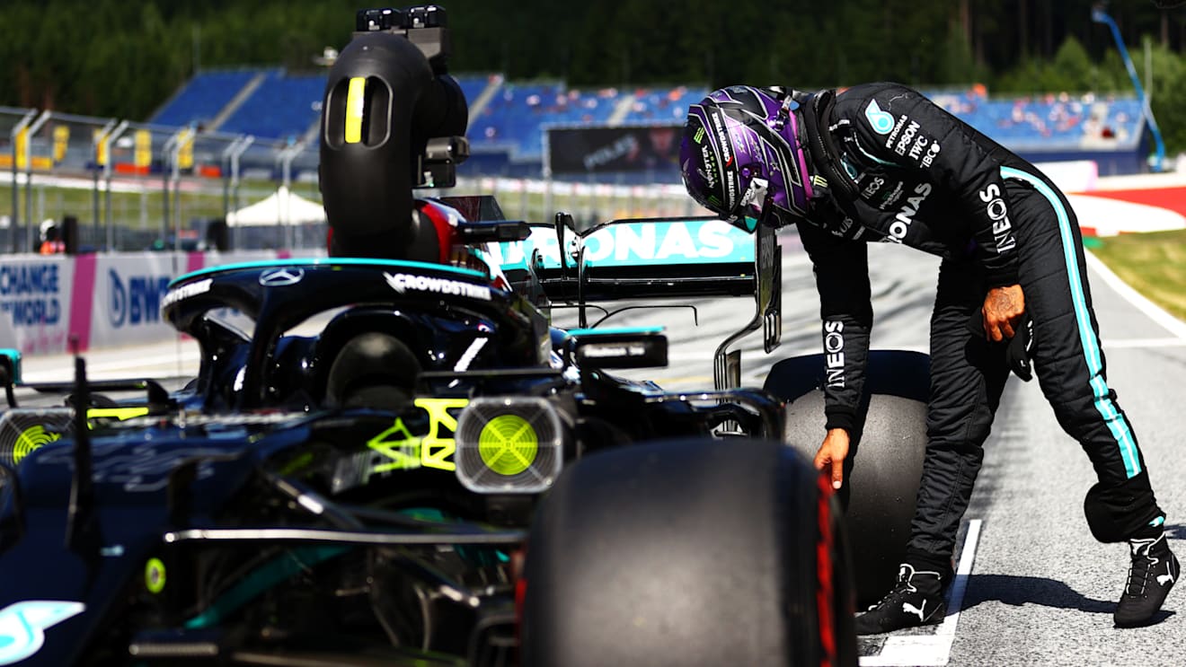 SPIELBERG, AUSTRIA - JUNE 26: Third place qualifier Lewis Hamilton of Great Britain and Mercedes GP inspects his car in parc ferme during qualifying ahead of the F1 Grand Prix of Styria at Red Bull Ring on June 26, 2021 in Spielberg, Austria. (Photo by Dan Istitene - Formula 1/Formula 1 via Getty Images)