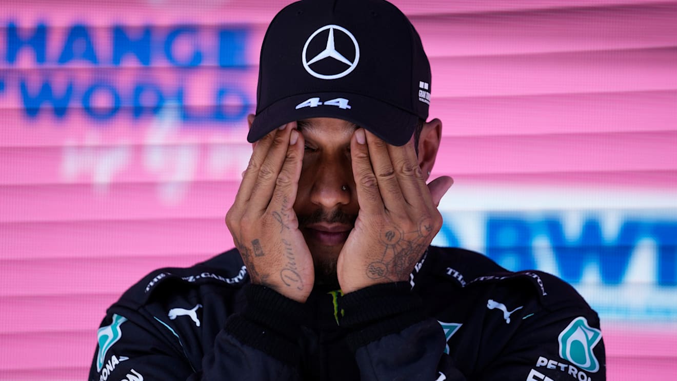 SPIELBERG, AUSTRIA - JUNE 26: Third place qualifier Lewis Hamilton of Great Britain and Mercedes GP wipes his face in parc ferme during qualifying ahead of the F1 Grand Prix of Styria at Red Bull Ring on June 26, 2021 in Spielberg, Austria. (Photo by Darko Vojinovic - Pool/Getty Images)