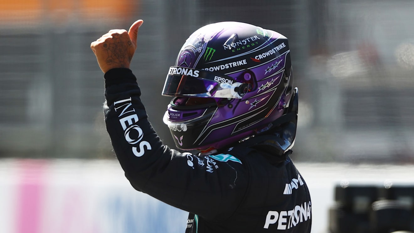 SPIELBERG, AUSTRIA - JUNE 26: Third place qualifier Lewis Hamilton of Great Britain and Mercedes GP waves to the crowd from parc ferme during qualifying ahead of the F1 Grand Prix of Styria at Red Bull Ring on June 26, 2021 in Spielberg, Austria. (Photo by Bryn Lennon/Getty Images)