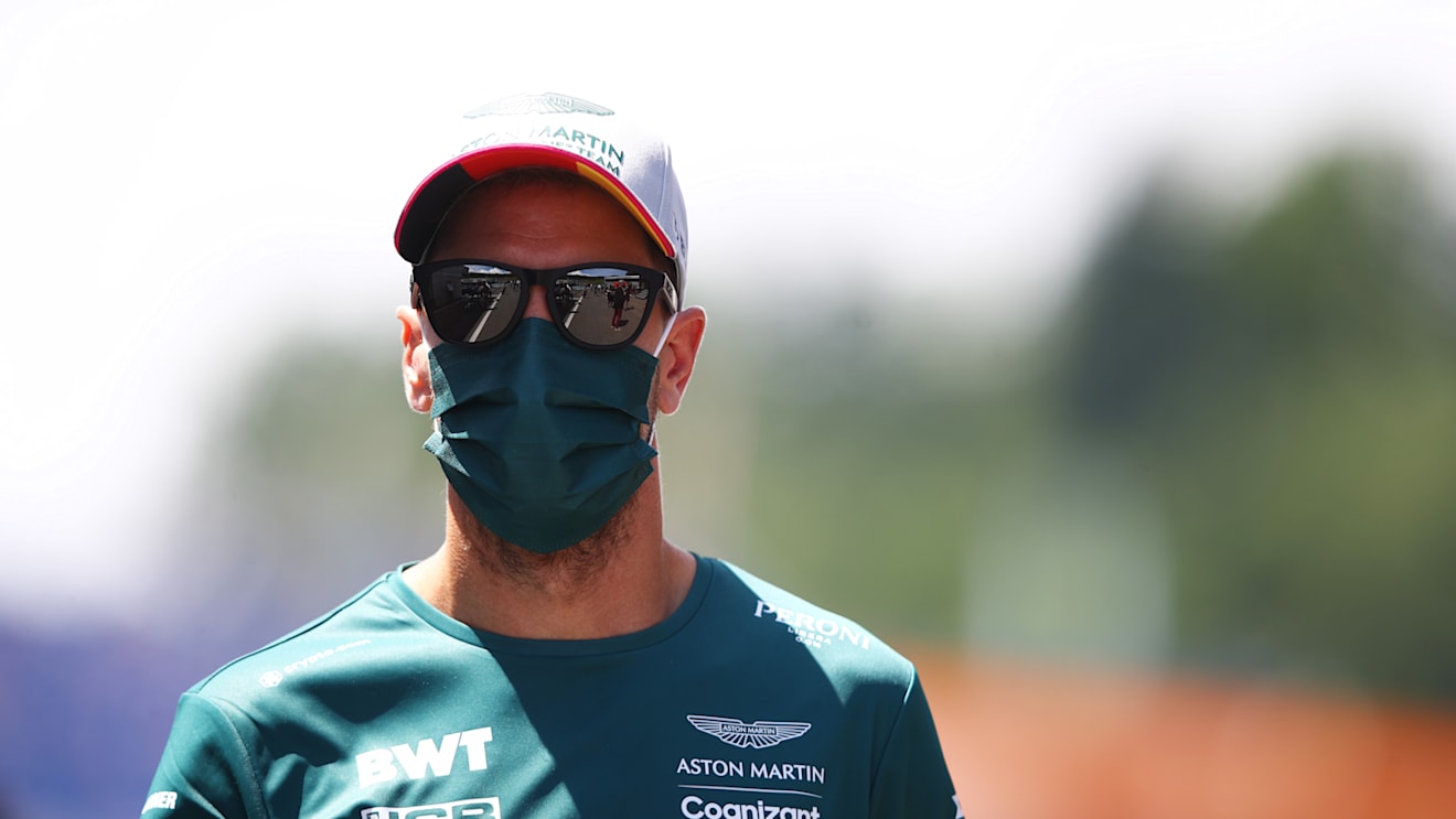 SPIELBERG, AUSTRIA - JUNE 27: Sebastian Vettel of Germany and Aston Martin F1 Team looks on from the drivers parade ahead of the F1 Grand Prix of Styria at Red Bull Ring on June 27, 2021 in Spielberg, Austria. (Photo by Mark Thompson/Getty Images)