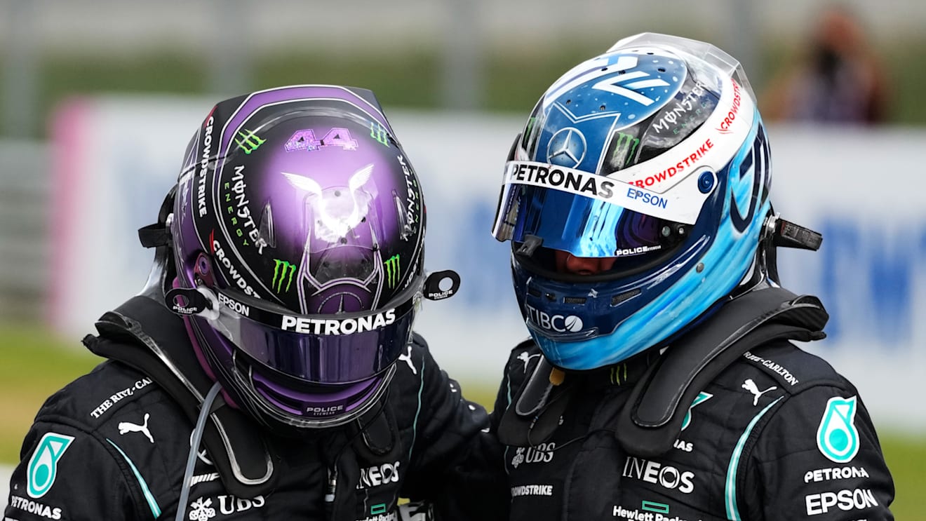 SPIELBERG, AUSTRIA - JUNE 27: Second placed Lewis Hamilton of Great Britain and Mercedes GP and third placed Valtteri Bottas of Finland and Mercedes GP hug in parc ferme during the F1 Grand Prix of Styria at Red Bull Ring on June 27, 2021 in Spielberg, Austria. (Photo by Darko Vojinovic - Pool/Getty Images)