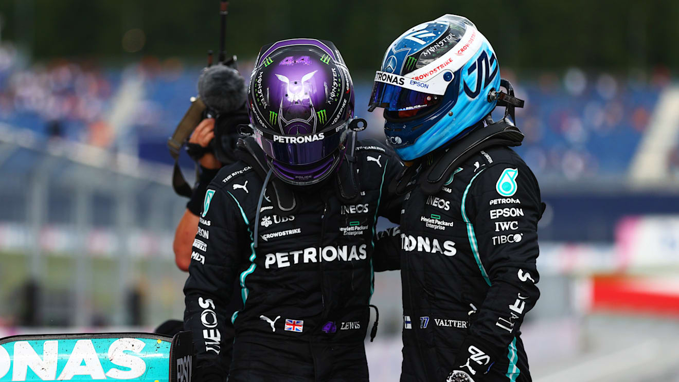 SPIELBERG, AUSTRIA - JUNE 27: Second placed Lewis Hamilton of Great Britain and Mercedes GP and third placed Valtteri Bottas of Finland and Mercedes GP hug in parc ferme during the F1 Grand Prix of Styria at Red Bull Ring on June 27, 2021 in Spielberg, Austria. (Photo by Dan Istitene - Formula 1/Formula 1 via Getty Images)
