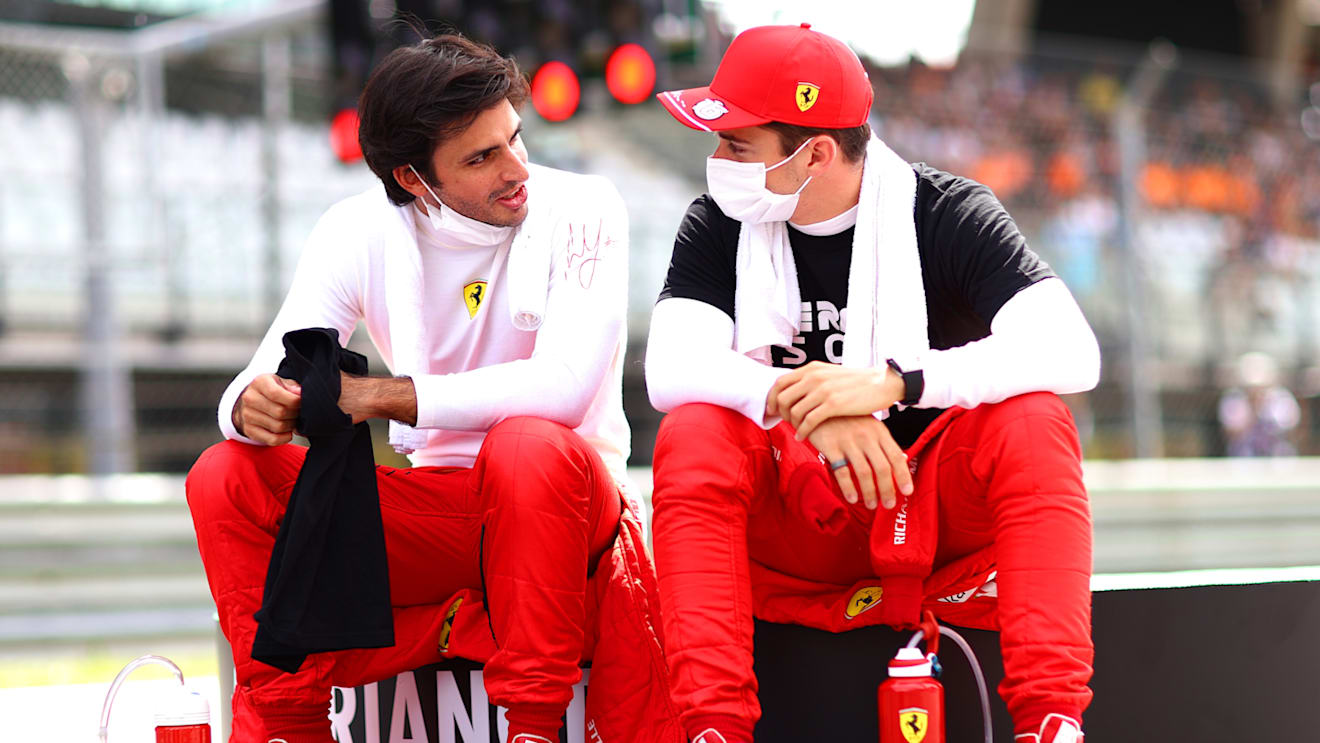 SPIELBERG, AUSTRIA - JUNE 27: Carlos Sainz of Spain and Ferrari and Charles Leclerc of Monaco and Ferrari talk on the grid ahead of the F1 Grand Prix of Styria at Red Bull Ring on June 27, 2021 in Spielberg, Austria. (Photo by Dan Istitene - Formula 1/Formula 1 via Getty Images)