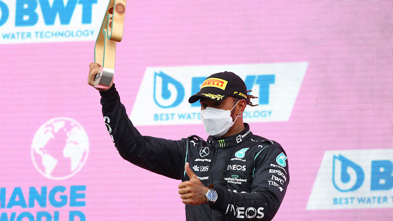 SPIELBERG, AUSTRIA - JUNE 27: Second placed Lewis Hamilton of Great Britain and Mercedes GP celebrates on the podium during the F1 Grand Prix of Styria at Red Bull Ring on June 27, 2021 in Spielberg, Austria. (Photo by Bryn Lennon/Getty Images)