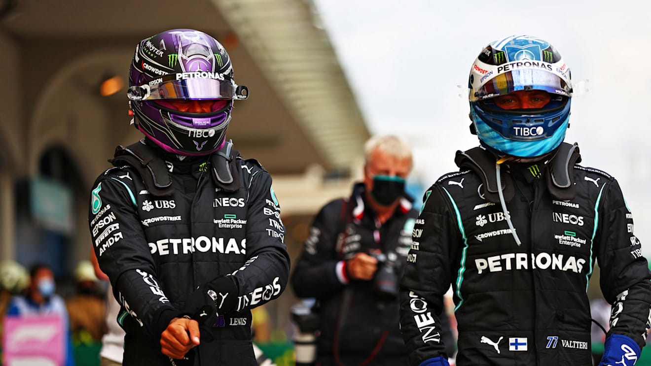 ISTANBUL, TURKEY - OCTOBER 09: Pole position qualifier Lewis Hamilton of Great Britain and Mercedes GP and second place qualifier Valtteri Bottas of Finland and Mercedes GP celebrate in parc ferme during qualifying ahead of the F1 Grand Prix of Turkey at Intercity Istanbul Park on October 09, 2021 in Istanbul, Turkey. (Photo by Dan Istitene - Formula 1/Formula 1 via Getty Images)