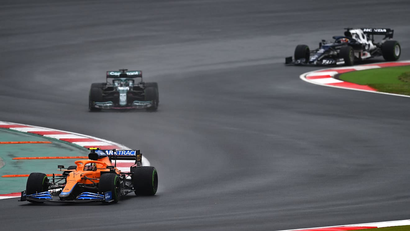 ISTANBUL, TURKEY - OCTOBER 10: Lando Norris of Great Britain driving the (4) McLaren F1 Team MCL35M Mercedes leads Lance Stroll of Canada driving the (18) Aston Martin AMR21 Mercedes during the F1 Grand Prix of Turkey at Intercity Istanbul Park on October 10, 2021 in Istanbul, Turkey. (Photo by Dan Mullan/Getty Images)
