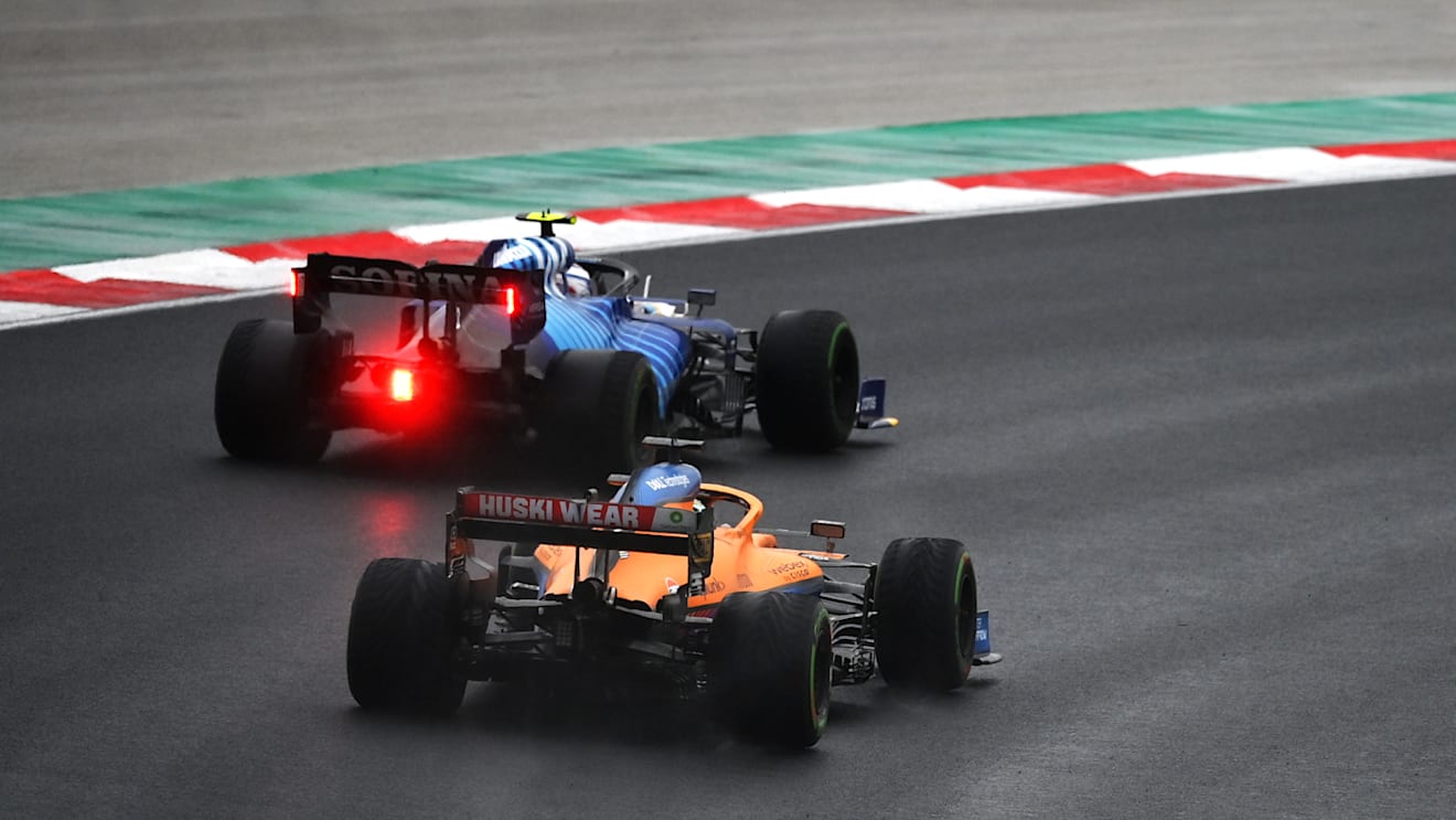 ISTANBUL, TURKEY - OCTOBER 10: Nicholas Latifi of Canada driving the (6) Williams Racing FW43B Mercedes leads Daniel Ricciardo of Australia driving the (3) McLaren F1 Team MCL35M Mercedes during the F1 Grand Prix of Turkey at Intercity Istanbul Park on October 10, 2021 in Istanbul, Turkey. (Photo by Dan Mullan/Getty Images)