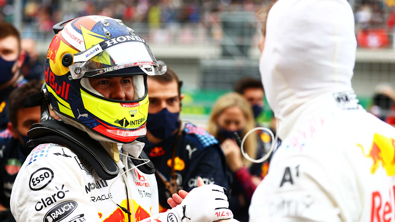 ISTANBUL, TURKEY - OCTOBER 10: Second placed Max Verstappen of Netherlands and Red Bull Racing and third placed Sergio Perez of Mexico and Red Bull Racing celebrate in parc ferme during the F1 Grand Prix of Turkey at Intercity Istanbul Park on October 10, 2021 in Istanbul, Turkey. (Photo by Dan Istitene - Formula 1/Formula 1 via Getty Images)