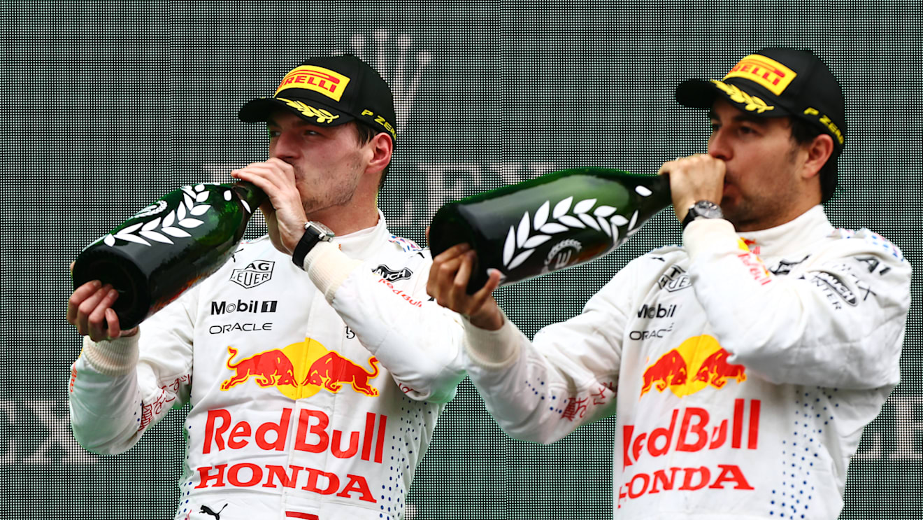 ISTANBUL, TURKEY - OCTOBER 10: Second placed Max Verstappen of Netherlands and Red Bull Racing and third placed Sergio Perez of Mexico and Red Bull Racing celebrate on the podiumduring the F1 Grand Prix of Turkey at Intercity Istanbul Park on October 10, 2021 in Istanbul, Turkey. (Photo by Mark Thompson/Getty Images)