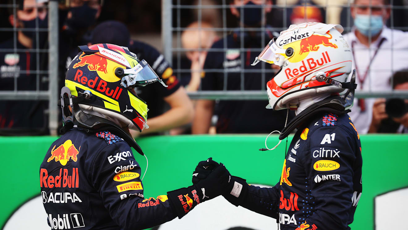 AUSTIN, TEXAS - OCTOBER 23: First place qualifier Max Verstappen of Netherlands and Red Bull Racing and third place qualifier Sergio Perez of Mexico and Red Bull Racing celebrate in parc ferme during qualifying ahead of the F1 Grand Prix of USA at Circuit of The Americas on October 23, 2021 in Austin, Texas. (Photo by Chris Graythen/Getty Images)