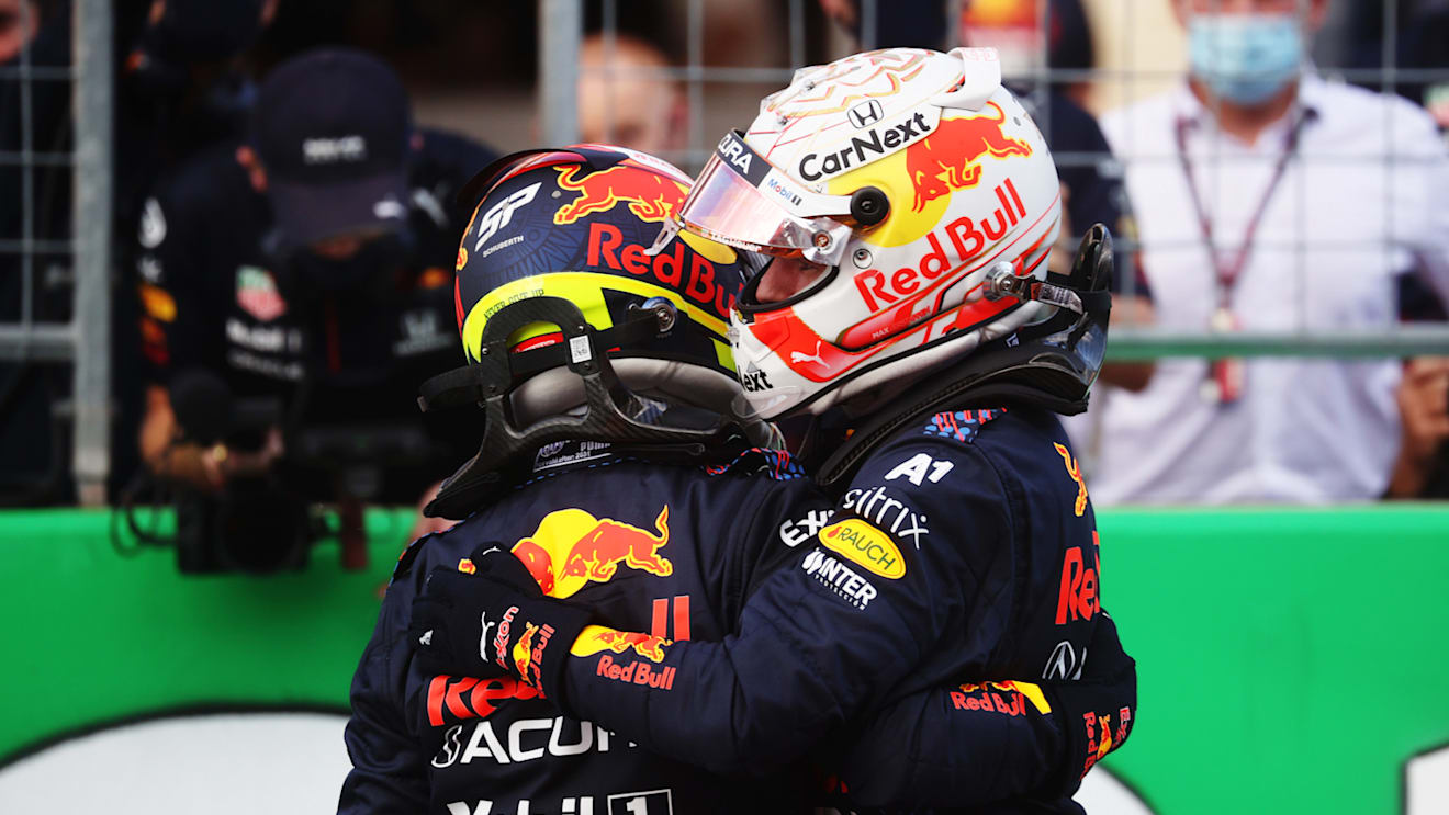 AUSTIN, TEXAS - OCTOBER 23: First place qualifier Max Verstappen of Netherlands and Red Bull Racing and third place qualifier Sergio Perez of Mexico and Red Bull Racing celebrate in parc ferme during qualifying ahead of the F1 Grand Prix of USA at Circuit of The Americas on October 23, 2021 in Austin, Texas. (Photo by Chris Graythen/Getty Images)