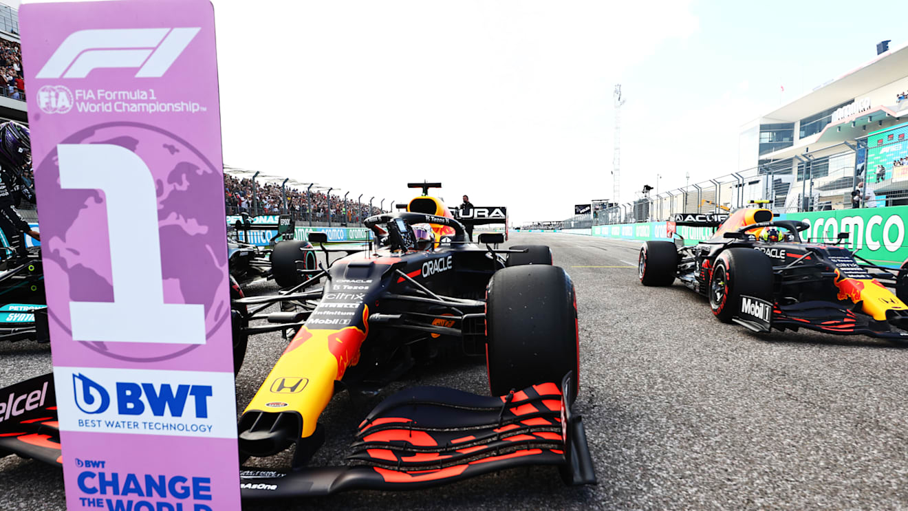 AUSTIN, TEXAS - OCTOBER 23: First place qualifier Max Verstappen of Netherlands and Red Bull Racing and third place qualifier Sergio Perez of Mexico and Red Bull Racing stop in parc ferme during qualifying ahead of the F1 Grand Prix of USA at Circuit of The Americas on October 23, 2021 in Austin, Texas. (Photo by Mark Thompson/Getty Images)