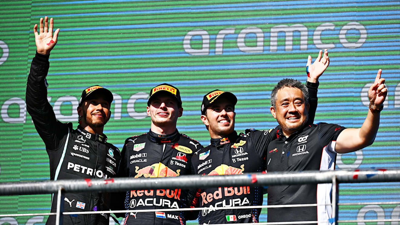 AUSTIN, TEXAS - OCTOBER 24: Race winner Max Verstappen of Netherlands and Red Bull Racing, second placed Lewis Hamilton of Great Britain and Mercedes GP, third placed Sergio Perez of Mexico and Red Bull Racing and Masashi Yamamoto of Honda celebrate on the podium during the F1 Grand Prix of USA at Circuit of The Americas on October 24, 2021 in Austin, Texas. (Photo by Clive Mason - Formula 1/Formula 1 via Getty Images)