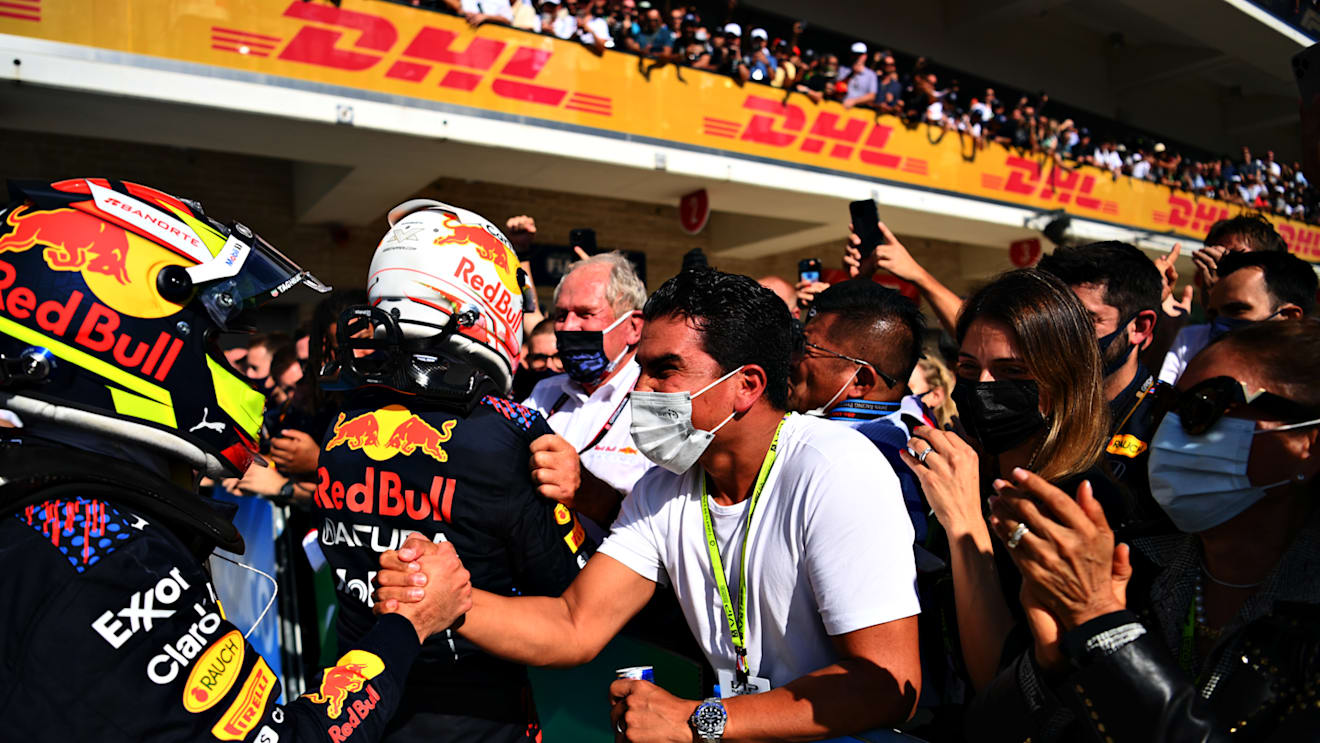AUSTIN, TEXAS - OCTOBER 24: Race winner Max Verstappen of Netherlands and Red Bull Racing and third placed Sergio Perez of Mexico and Red Bull Racing celebrate in parc ferme during the F1 Grand Prix of USA at Circuit of The Americas on October 24, 2021 in Austin, Texas. (Photo by Clive Mason - Formula 1/Formula 1 via Getty Images)