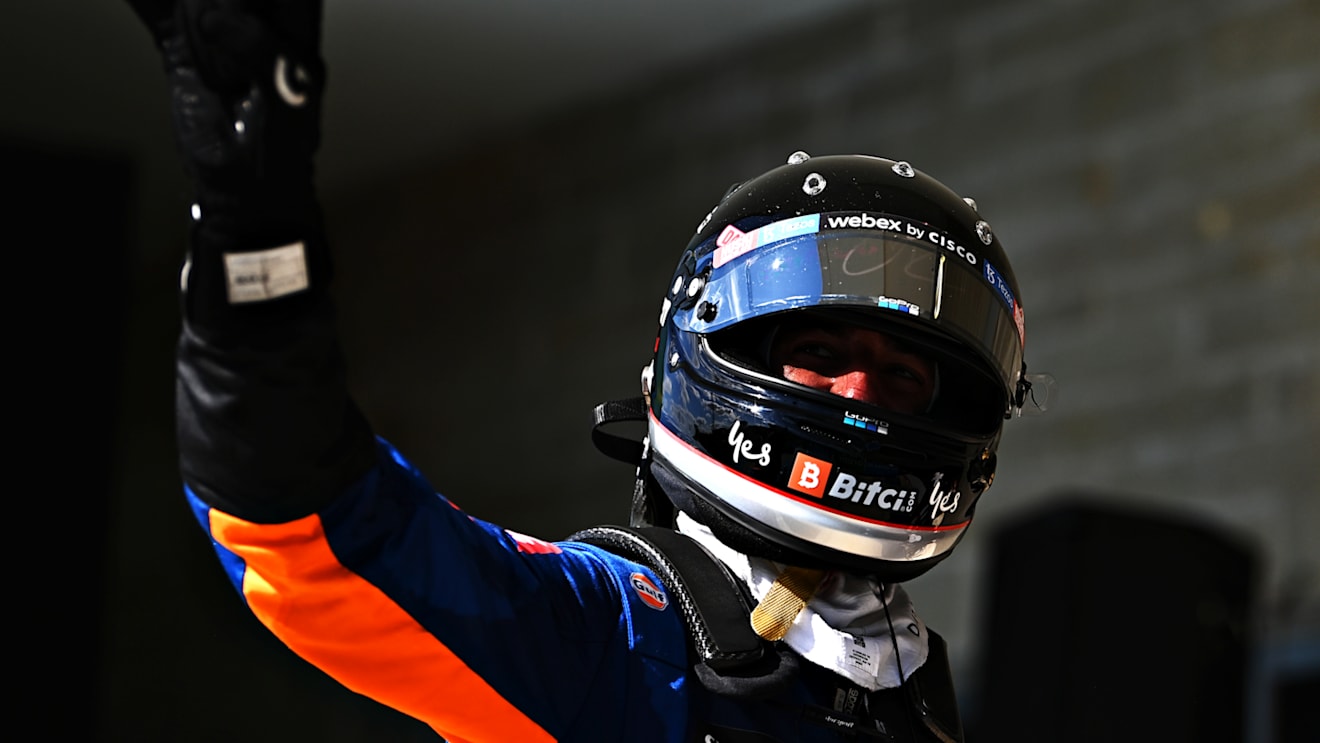 AUSTIN, TEXAS - OCTOBER 24: Daniel Ricciardo of Australia and McLaren F1 waves to the crowd from parc ferme during the F1 Grand Prix of USA at Circuit of The Americas on October 24, 2021 in Austin, Texas. (Photo by Clive Mason - Formula 1/Formula 1 via Getty Images)