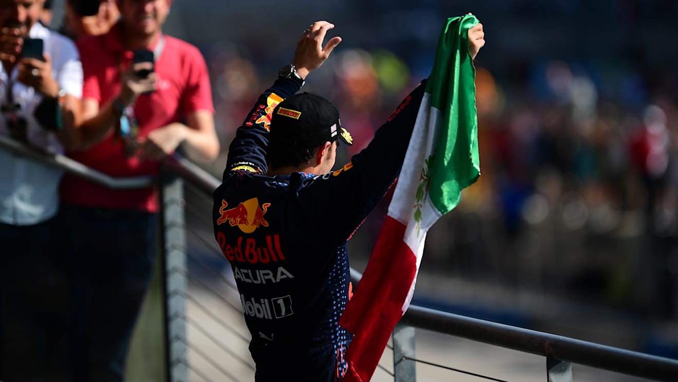 AUSTIN, TEXAS - OCTOBER 24: Third placed Sergio Perez of Mexico and Red Bull Racing celebrates on the podium during the F1 Grand Prix of USA at Circuit of The Americas on October 24, 2021 in Austin, Texas. (Photo by Mario Renzi - Formula 1/Formula 1 via Getty Images)