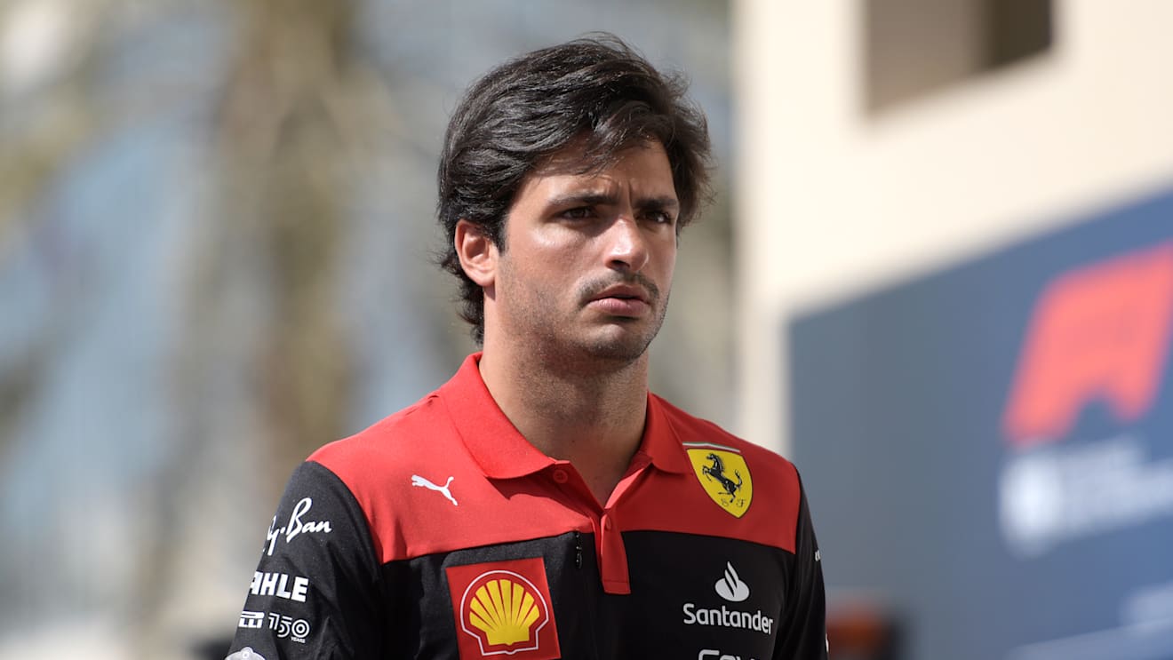ABU DHABI, UNITED ARAB EMIRATES - NOVEMBER 18: Carlos Sainz of Spain and Ferrari walks in the paddock  prior to practice ahead of the F1 Grand Prix of Abu Dhabi at Yas Marina Circuit on November 18, 2022 in Abu Dhabi, United Arab Emirates. (Photo by Rudy Carezzevoli/Getty Images)