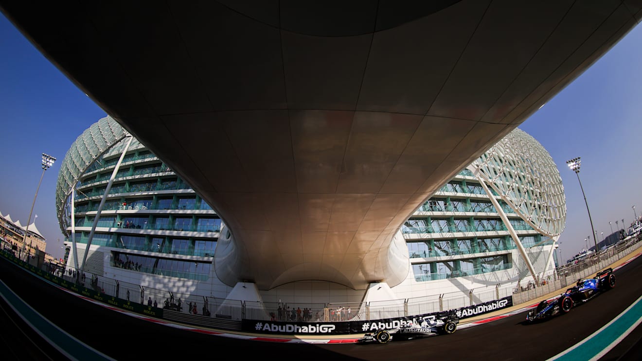 ABU DHABI, UNITED ARAB EMIRATES - NOVEMBER 19: Pierre Gasly of France driving the (10) Scuderia AlphaTauri AT03 leads Alexander Albon of Thailand driving the (23) Williams FW44 Mercedes on track during final practice ahead of the F1 Grand Prix of Abu Dhabi at Yas Marina Circuit on November 19, 2022 in Abu Dhabi, United Arab Emirates. (Photo by Bryn Lennon - Formula 1/Formula 1 via Getty Images)