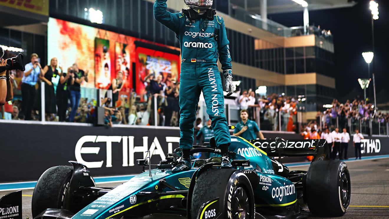 ABU DHABI, UNITED ARAB EMIRATES - NOVEMBER 20: Tenth placed Sebastian Vettel of Germany and Aston Martin F1 Team waves to the crowd following his final race in F1 during the F1 Grand Prix of Abu Dhabi at Yas Marina Circuit on November 20, 2022 in Abu Dhabi, United Arab Emirates. (Photo by Dan Istitene - Formula 1/Formula 1 via Getty Images)