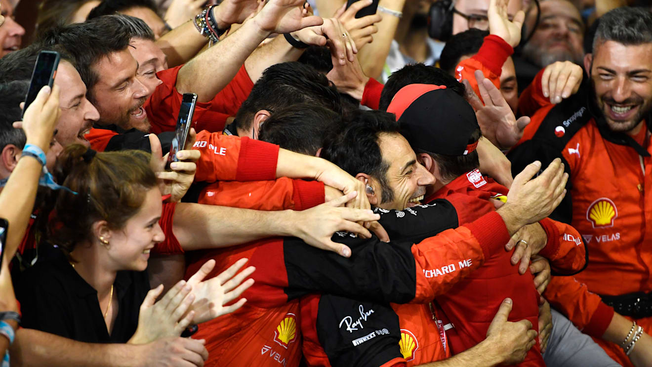 ABU DHABI, UNITED ARAB EMIRATES - NOVEMBER 20: Second placed Charles Leclerc of Monaco and Ferrari celebrates with teammates following the F1 Grand Prix of Abu Dhabi at Yas Marina Circuit on November 20, 2022 in Abu Dhabi, United Arab Emirates. (Photo by Rudy Carezzevoli/Getty Images)