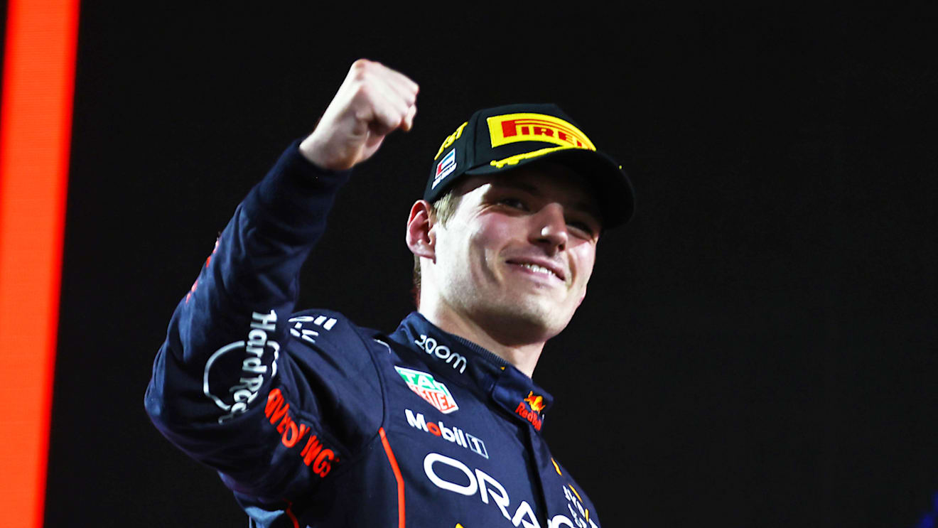 ABU DHABI, UNITED ARAB EMIRATES - NOVEMBER 20: Race winner Max Verstappen of the Netherlands and Oracle Red Bull Racing celebrates on the podium following the F1 Grand Prix of Abu Dhabi at Yas Marina Circuit on November 20, 2022 in Abu Dhabi, United Arab Emirates. (Photo by Mark Thompson/Getty Images)