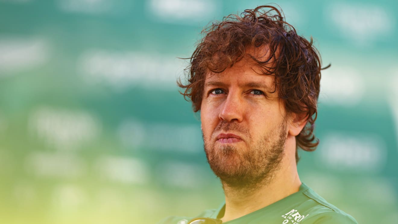 MELBOURNE, AUSTRALIA - APRIL 08: Sebastian Vettel of Germany and Aston Martin F1 Team looks on in the Paddock prior to practice ahead of the F1 Grand Prix of Australia at Melbourne Grand Prix Circuit on April 08, 2022 in Melbourne, Australia. (Photo by Dan Istitene - Formula 1/Formula 1 via Getty Images)
