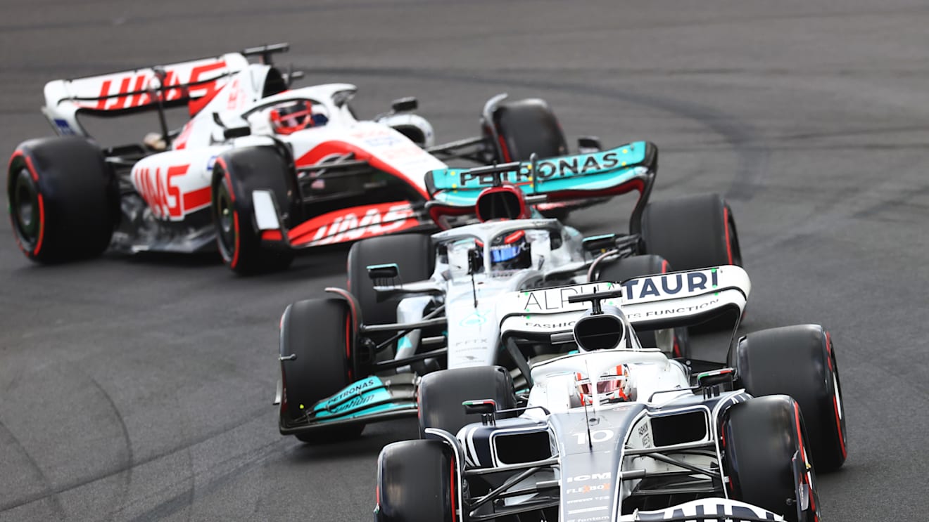 MELBOURNE, AUSTRALIA - APRIL 09: Pierre Gasly of France driving the (10) Scuderia AlphaTauri AT03 leads George Russell of Great Britain driving the (63) Mercedes AMG Petronas F1 Team W13 and Kevin Magnussen of Denmark driving the (20) Haas F1 VF-22 Ferrari on track during qualifying ahead of the F1 Grand Prix of Australia at Melbourne Grand Prix Circuit on April 09, 2022 in Melbourne, Australia. (Photo by Dan Istitene - Formula 1/Formula 1 via Getty Images)