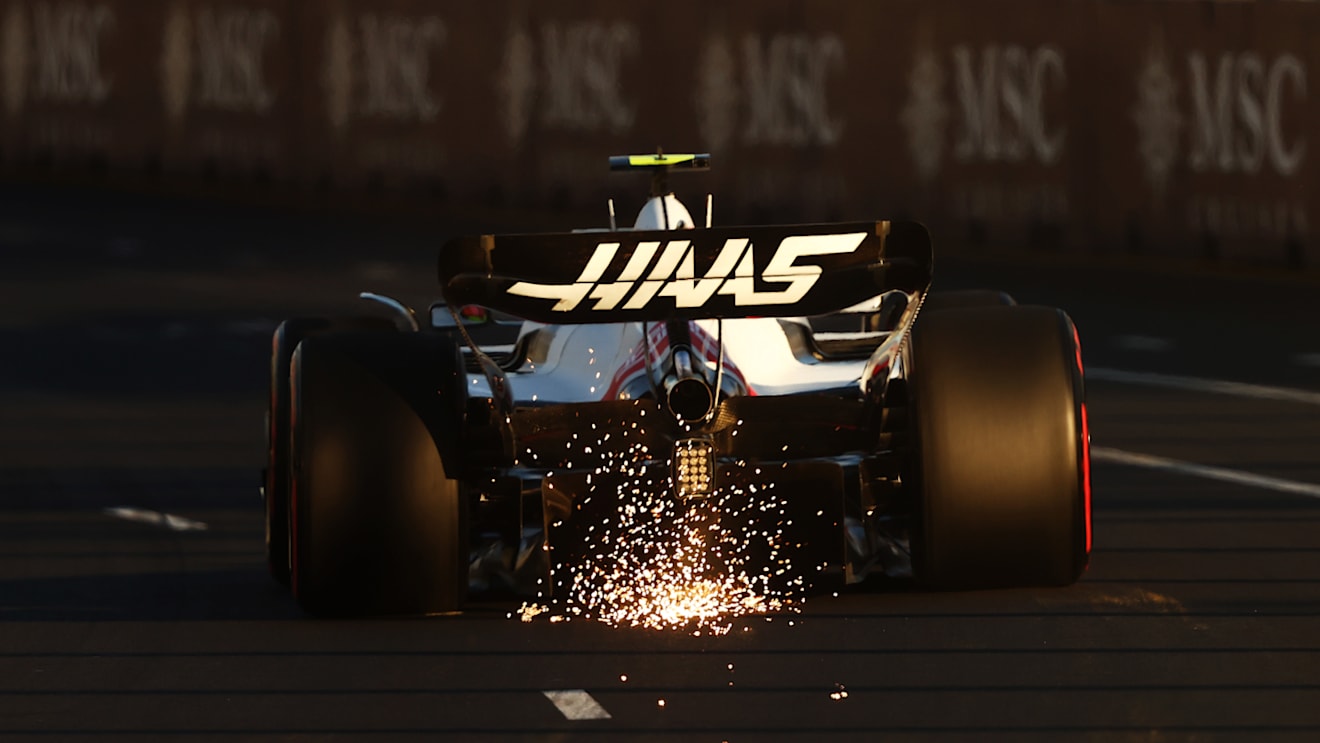 MELBOURNE, AUSTRALIA - APRIL 09: Sparks fly behind Mick Schumacher of Germany driving the (47) Haas F1 VF-22 Ferrari on track during qualifying ahead of the F1 Grand Prix of Australia at Melbourne Grand Prix Circuit on April 09, 2022 in Melbourne, Australia. (Photo by Bryn Lennon - Formula 1/Formula 1 via Getty Images)