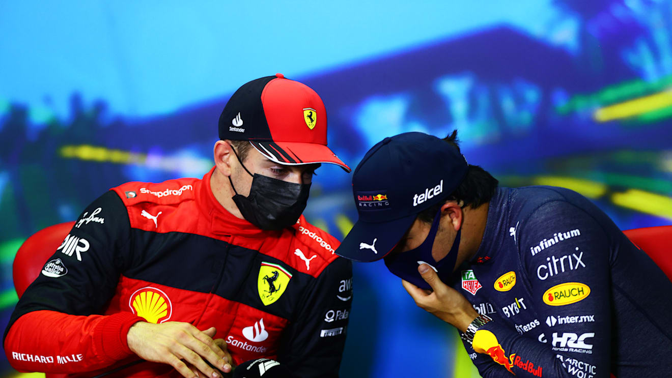 MELBOURNE, AUSTRALIA - APRIL 09: Pole position qualifier Charles Leclerc of Monaco and Ferrari and Third placed qualifier Sergio Perez of Mexico and Oracle Red Bull Racing talk in the press conference after qualifying ahead of the F1 Grand Prix of Australia at Melbourne Grand Prix Circuit on April 09, 2022 in Melbourne, Australia. (Photo by Dan Istitene - Formula 1/Formula 1 via Getty Images)