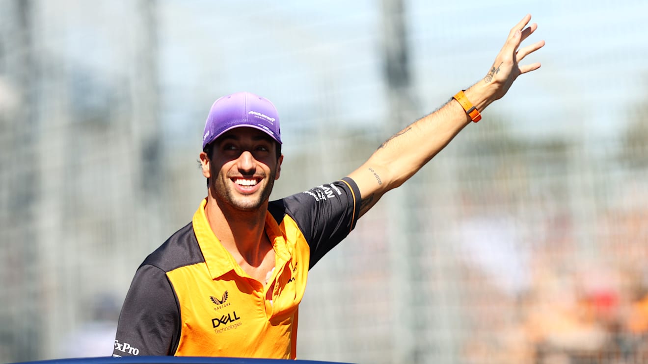 MELBOURNE, AUSTRALIA - APRIL 10: Daniel Ricciardo of Australia and McLaren waves to the crowd on the drivers parade ahead of the F1 Grand Prix of Australia at Melbourne Grand Prix Circuit on April 10, 2022 in Melbourne, Australia. (Photo by Dan Istitene - Formula 1/Formula 1 via Getty Images)