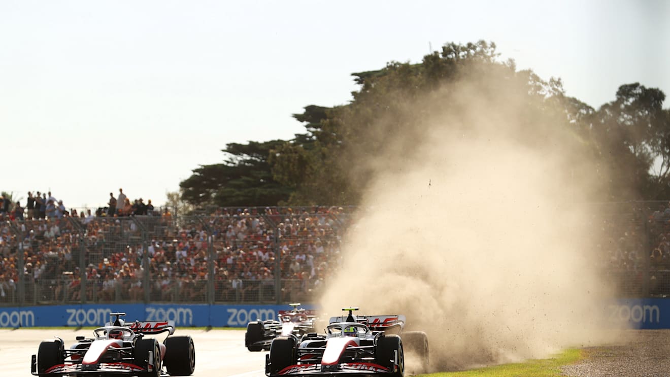 MELBOURNE, AUSTRALIA - APRIL 10: Mick Schumacher of Germany driving the (47) Haas F1 VF-22 Ferrari runs wide next to Kevin Magnussen of Denmark driving the (20) Haas F1 VF-22 Ferrari during the F1 Grand Prix of Australia at Melbourne Grand Prix Circuit on April 10, 2022 in Melbourne, Australia. (Photo by Robert Cianflone/Getty Images)