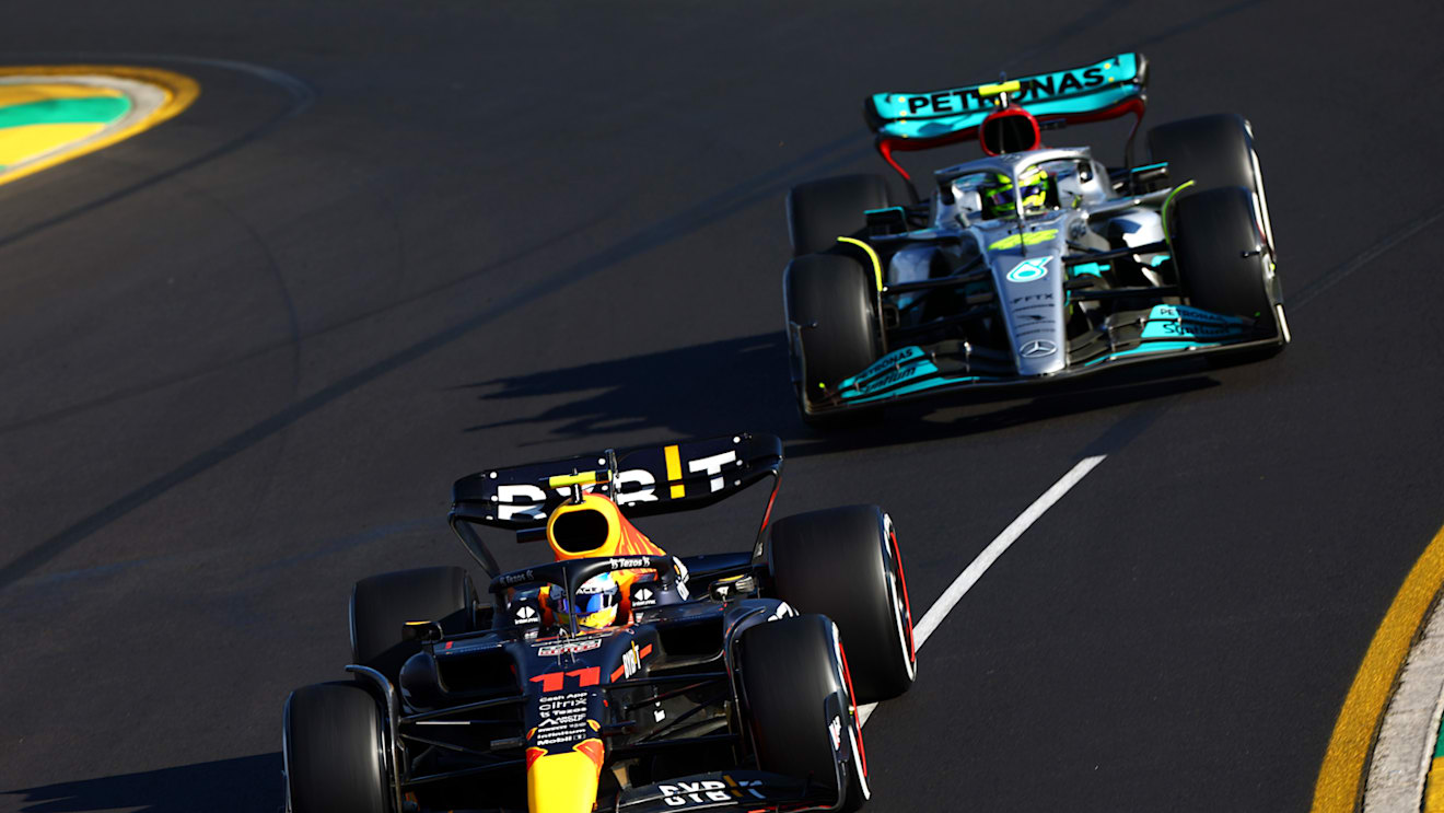 MELBOURNE, AUSTRALIA - APRIL 10: Sergio Perez of Mexico driving the (11) Oracle Red Bull Racing RB18 leads Lewis Hamilton of Great Britain driving the (44) Mercedes AMG Petronas F1 Team W13 during the F1 Grand Prix of Australia at Melbourne Grand Prix Circuit on April 10, 2022 in Melbourne, Australia. (Photo by Mark Thompson/Getty Images)