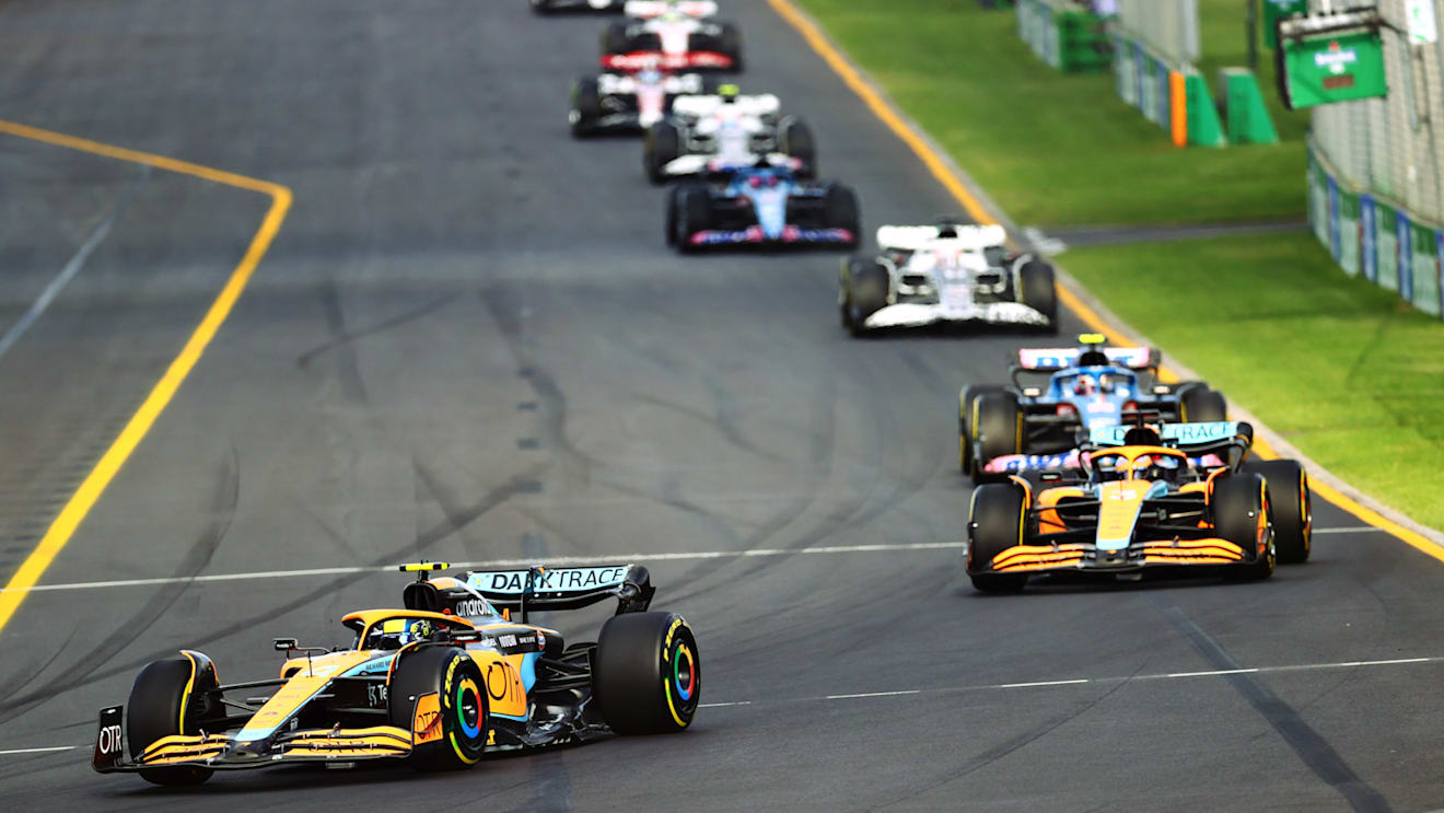MELBOURNE, AUSTRALIA - APRIL 10: Lando Norris of Great Britain driving the (4) McLaren MCL36 Mercedes leads Daniel Ricciardo of Australia driving the (3) McLaren MCL36 Mercedes during the F1 Grand Prix of Australia at Melbourne Grand Prix Circuit on April 10, 2022 in Melbourne, Australia. (Photo by Dan Istitene - Formula 1/Formula 1 via Getty Images)
