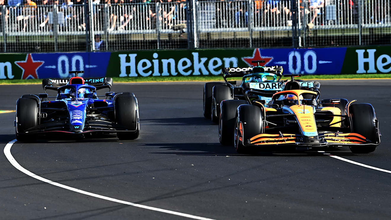 MELBOURNE, AUSTRALIA - APRIL 10: Daniel Ricciardo of Australia driving the (3) McLaren MCL36 Mercedes leads Alexander Albon of Thailand driving the (23) Williams FW44 Mercedes and Lance Stroll of Canada driving the (18) Aston Martin AMR22 Mercedes during the F1 Grand Prix of Australia at Melbourne Grand Prix Circuit on April 10, 2022 in Melbourne, Australia. (Photo by Bill Murray/Getty Images for Heineken)
